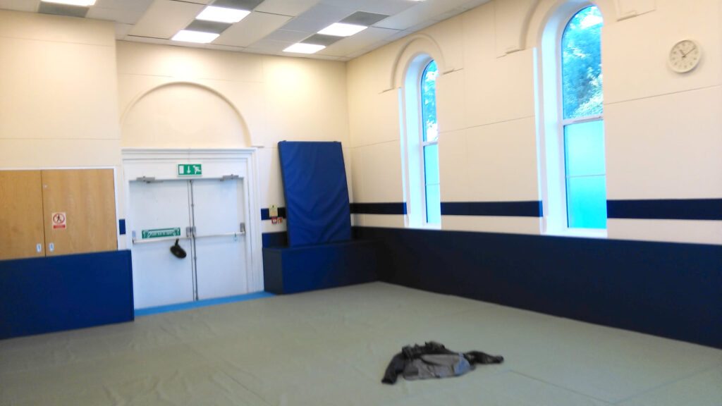 Dojo at South Oxford Community Centre, Oxford A 6x9m space used for martial arts. esp. Aikido. My jacket and scarf included for scale!