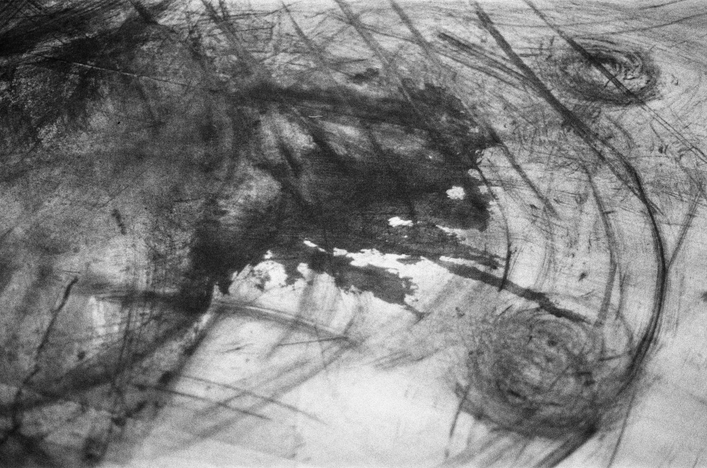 Residuals #1 image 013. Artists Andrew Wood & John Hazel. Charcoal on paper. Created 16 January 2024 at Old Fire Station dance studio, Oxford. UK. Photo: Andrew Wood. Black & whtie 35mm film photograph.