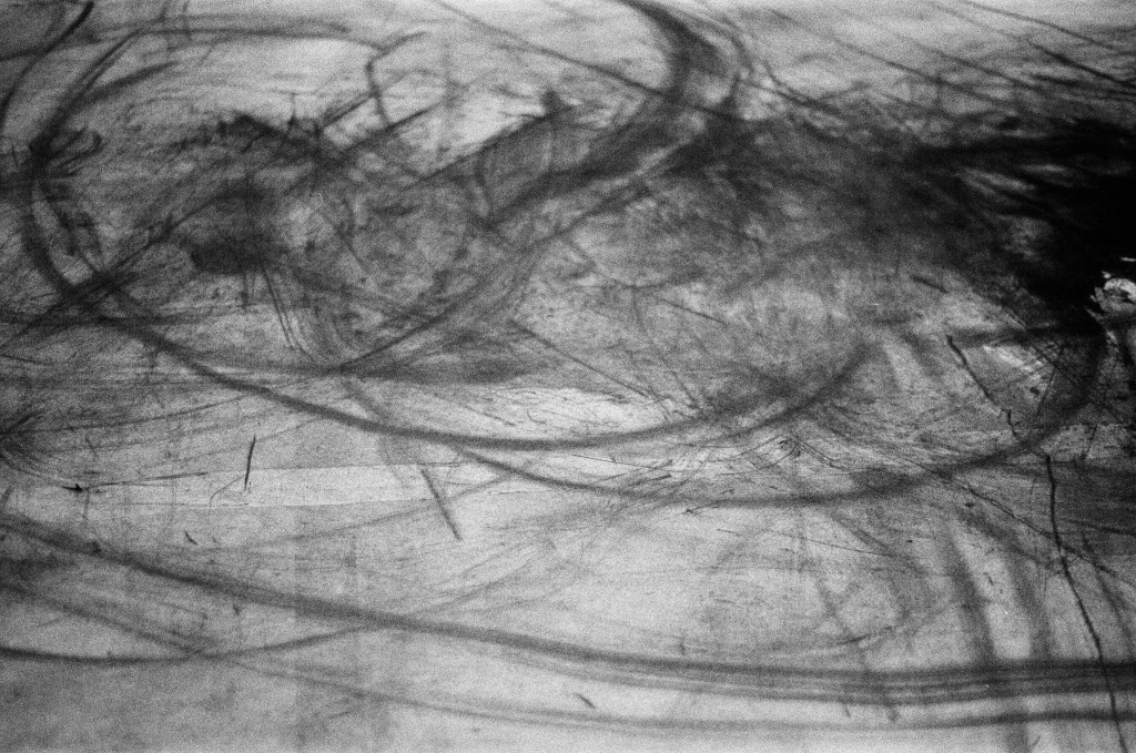 Residuals #1 image 014. Artists Andrew Wood & John Hazel. Charcoal on paper. Created 16 January 2024 at Old Fire Station dance studio, Oxford. UK. Photo: Andrew Wood. Black & whtie 35mm film photograph.