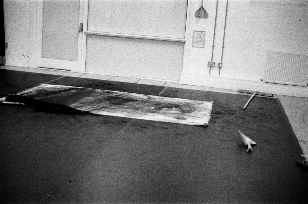 Residuals #1 image 015. Artists Andrew Wood & John Hazel. Charcoal on paper. Created 16 January 2024 at Old Fire Station dance studio, Oxford. UK. Photo: Andrew Wood. Black & white 35mm film photograph.