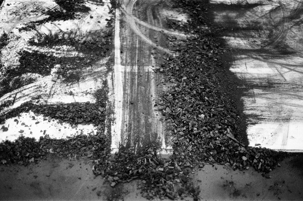 Residuals #1 image 0024. Artists Andrew Wood & John Hazel. Charcoal on paper. Created 16 January 2024 at Old Fire Station dance studio, Oxford. UK. Photo: Andrew Wood. Black & white 35mm film photograph.