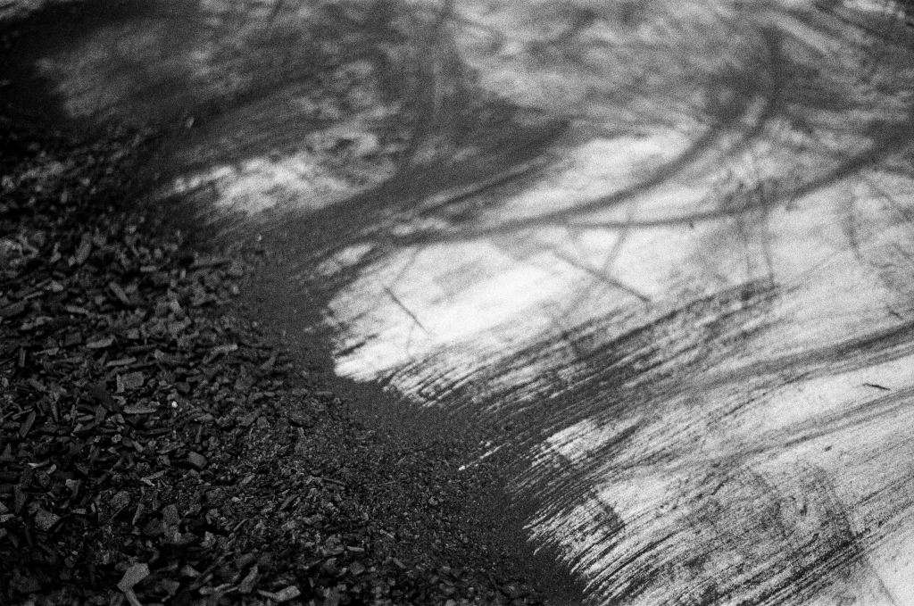 Residuals #1 image 0025. Artists Andrew Wood & John Hazel. Charcoal on paper. Created 16 January 2024 at Old Fire Station dance studio, Oxford. UK. Photo: Andrew Wood. Black & white 35mm film photograph.