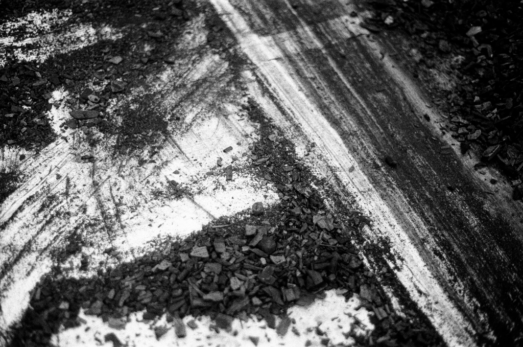 Residuals #1 image 0026. Artists Andrew Wood & John Hazel. Charcoal on paper. Created 16 January 2024 at Old Fire Station dance studio, Oxford. UK. Photo: Andrew Wood. Black & white 35mm film photograph.