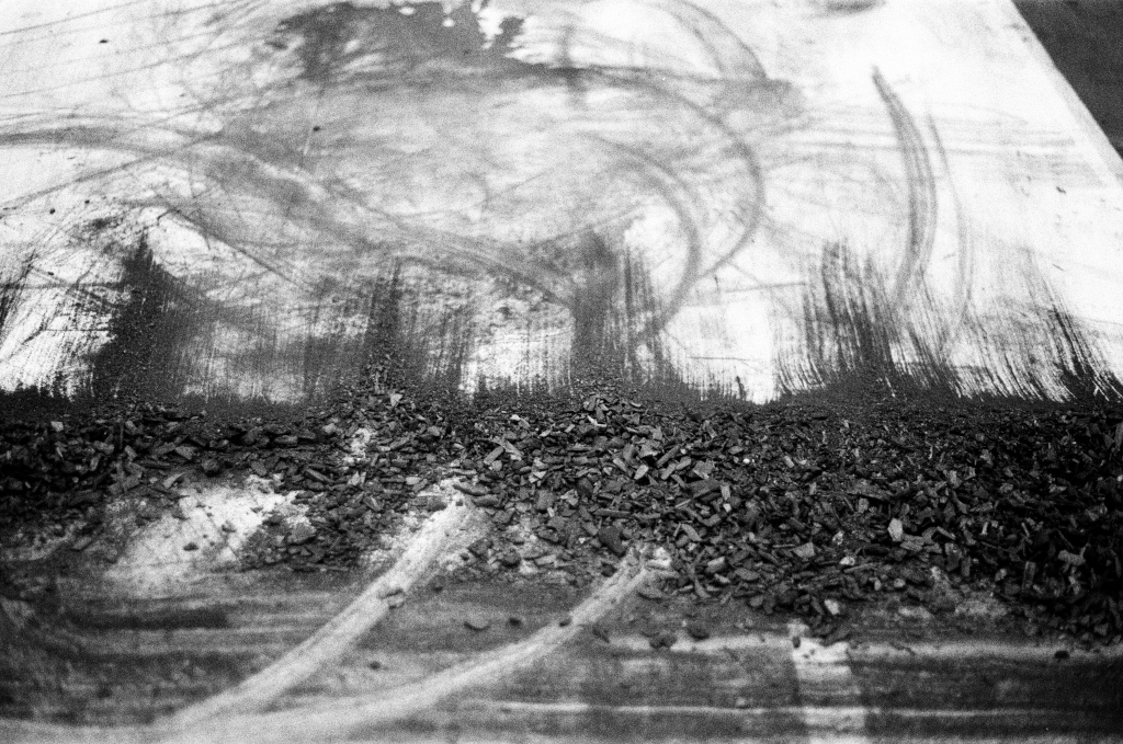 Residuals #1 image 0029. Artists Andrew Wood & John Hazel. Charcoal on paper. Created 16 January 2024 at Old Fire Station dance studio, Oxford. UK. Photo: Andrew Wood. Black & white 35mm film photograph.