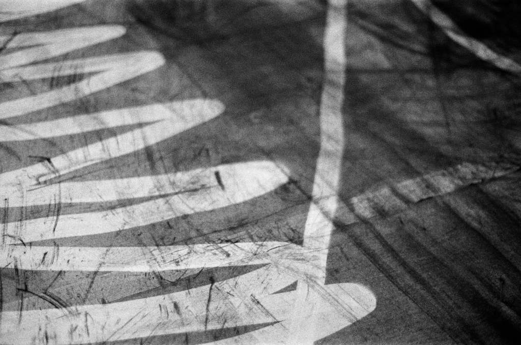 Residuals #1 image 007. Artists Andrew Wood & John Hazel. Charcoal on paper. Created 16 January 2024 at Old Fire Station dance studio, Oxford. UK. Photo: Andrew Wood. Black & whtie 35mm film photograph.