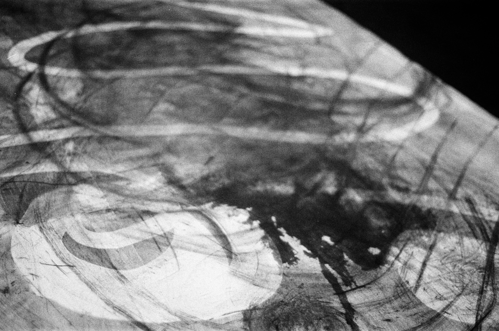 Residuals #1 image 009. Artists Andrew Wood & John Hazel. Charcoal on paper. Created 16 January 2024 at Old Fire Station dance studio, Oxford. UK. Photo: Andrew Wood. Black & whtie 35mm film photograph.