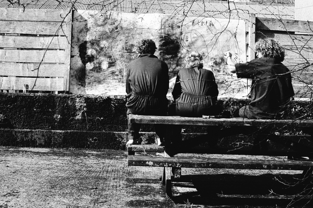 Residuals #2: Artists John, Steph and Thom study Residuals #2 which is hung on the fence in the court yard at Shippon Artists Studios, Dartington Estate, Devon, England. Photo: Andrew Wood